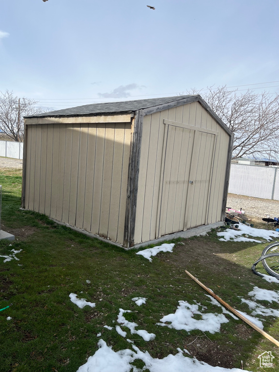 View of shed with fence