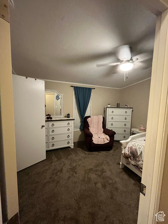 Bedroom featuring ornamental molding, carpet, and ceiling fan