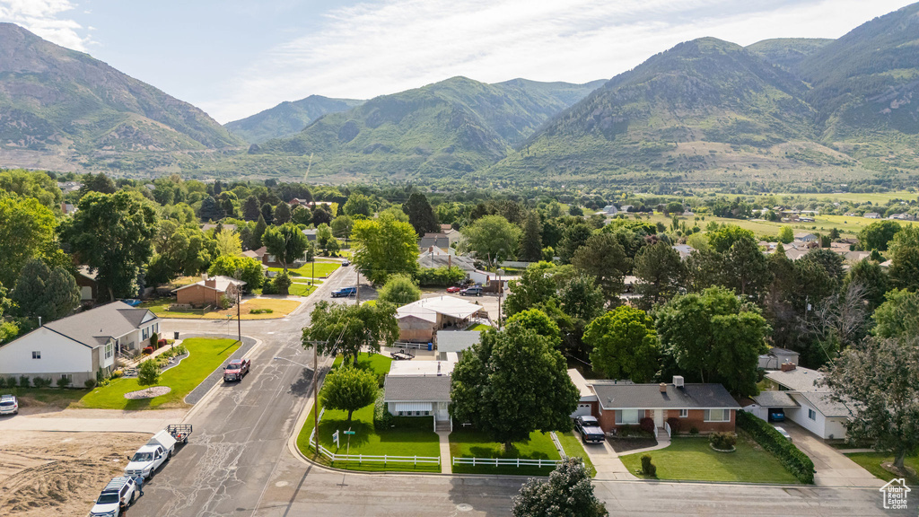 Aerial perspective of suburban area featuring a mountainous background