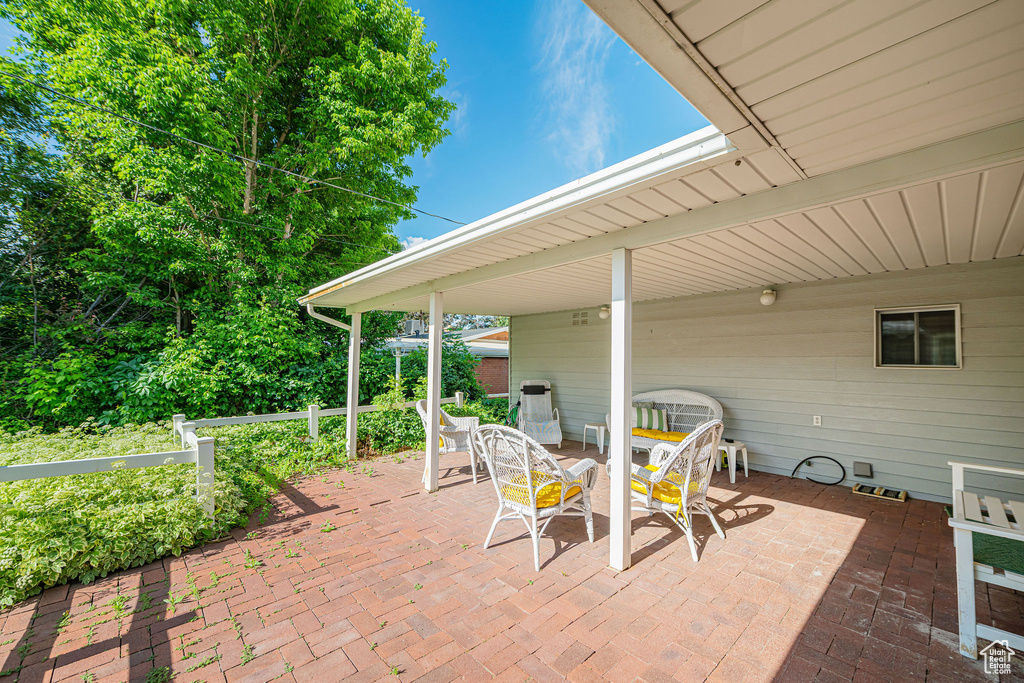 View of patio with outdoor dining area