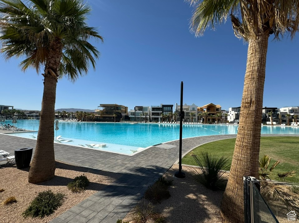 Community pool with a patio