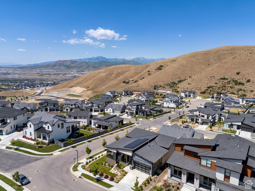 Aerial view of residential area featuring a mountain backdrop