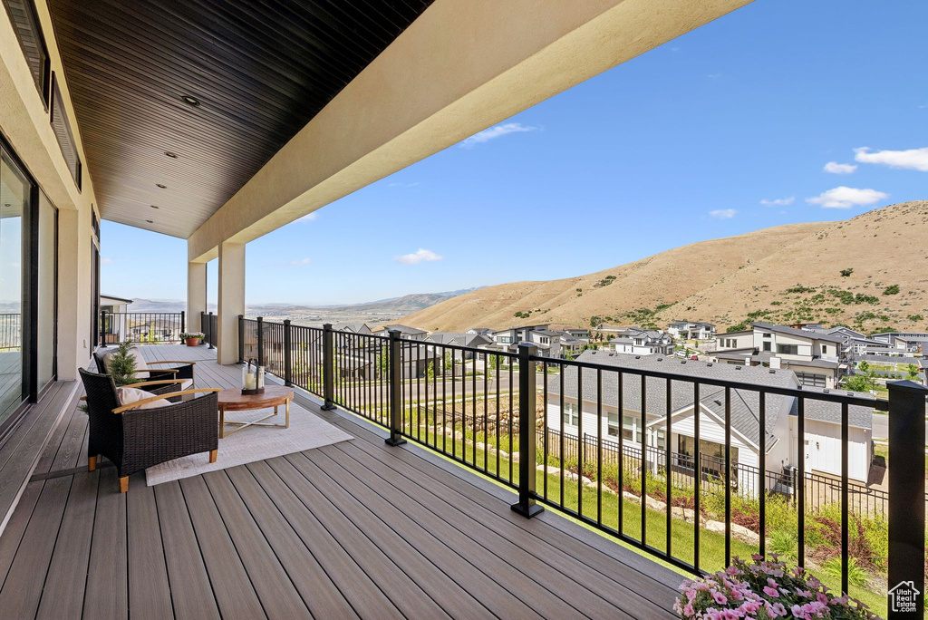 Wooden terrace with a mountain view and a residential view