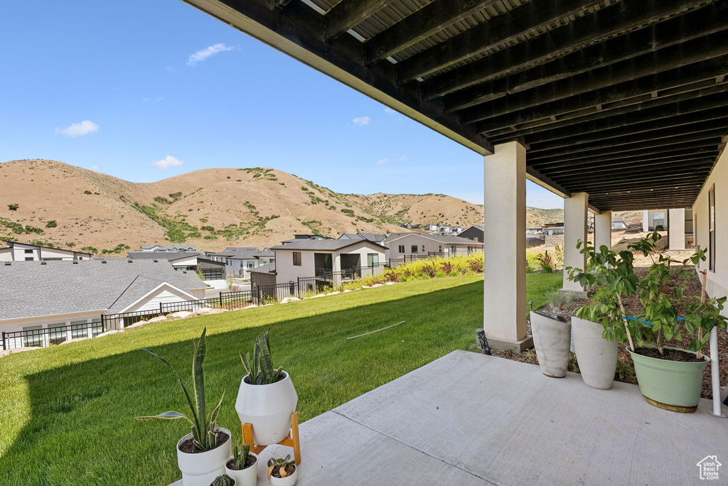 View of patio featuring a residential view and a mountain view