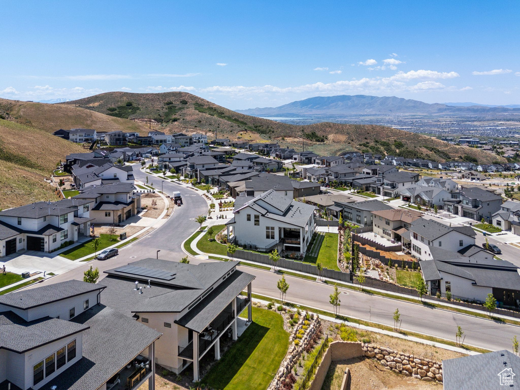 Aerial perspective of suburban area featuring a mountainous background