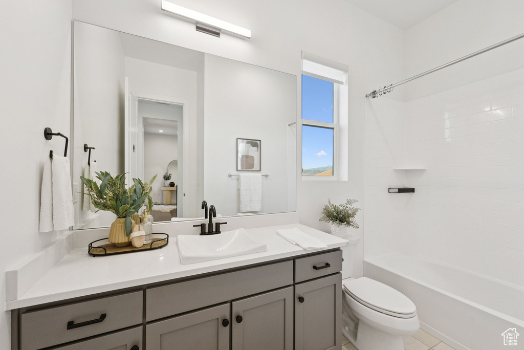 Full bath featuring vanity, toilet, and bathtub / shower combination