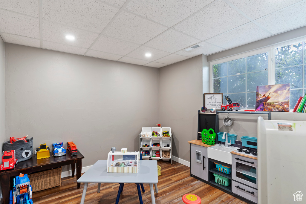 Rec room featuring visible vents, baseboards, wood finished floors, recessed lighting, and a paneled ceiling