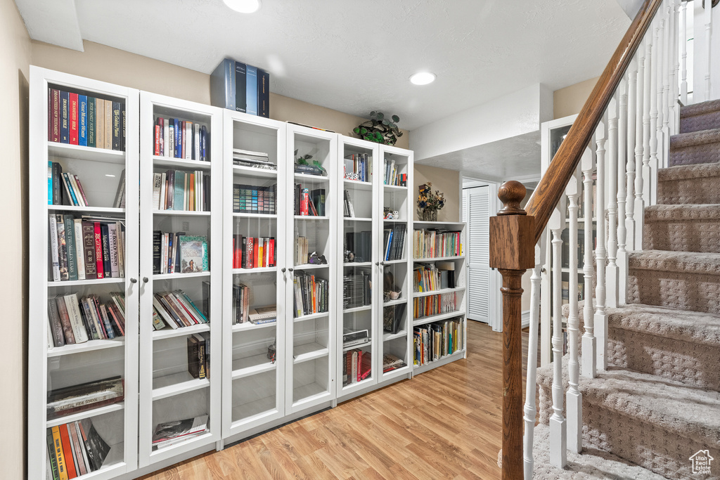 Living area featuring wood finished floors and stairway