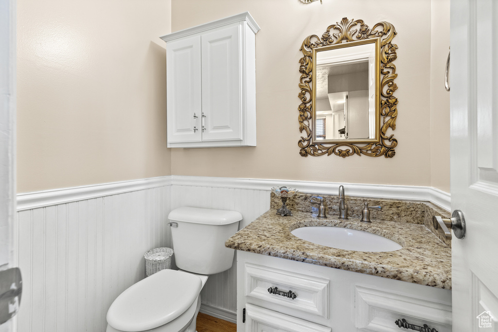 Bathroom with wainscoting and vanity