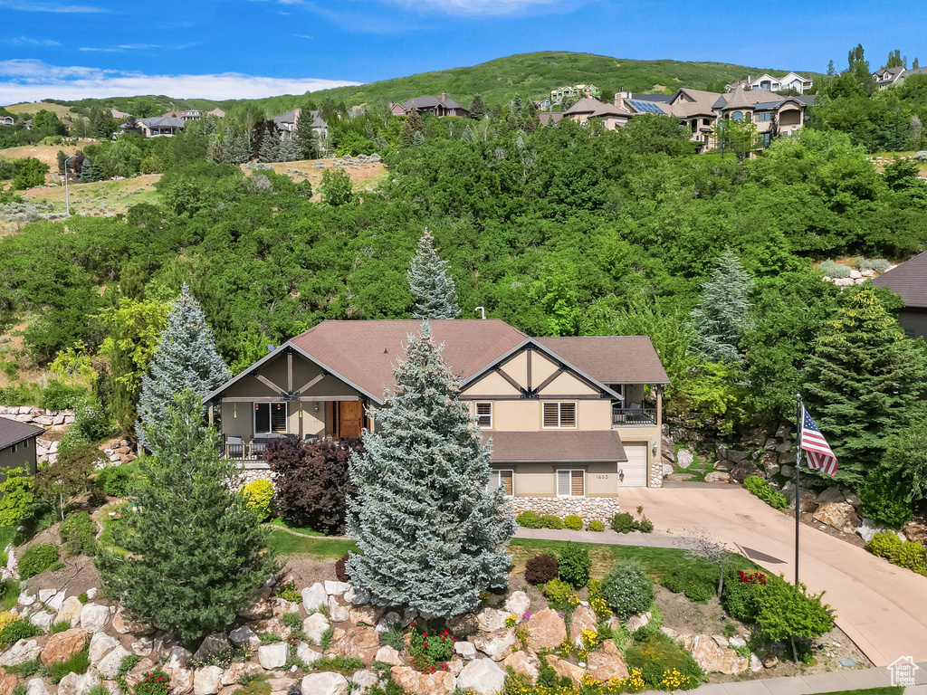 View of subject property with mountains