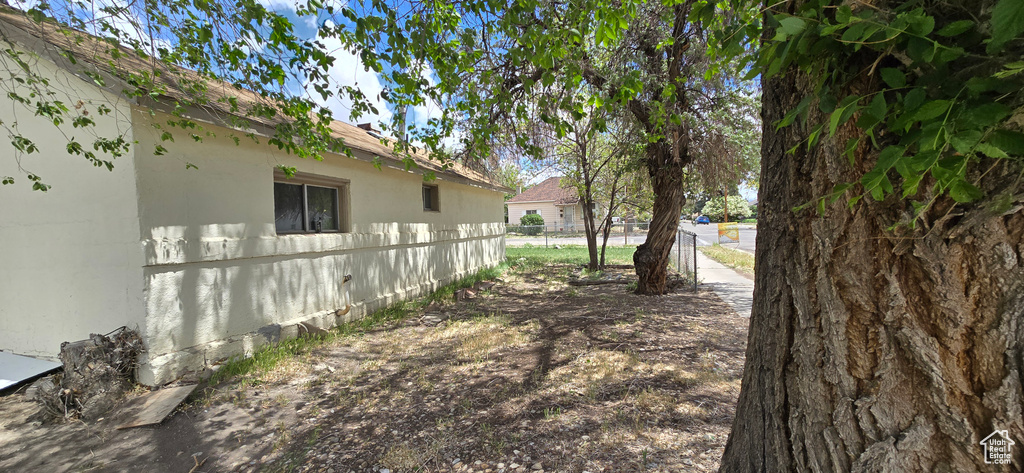 View of yard featuring fence