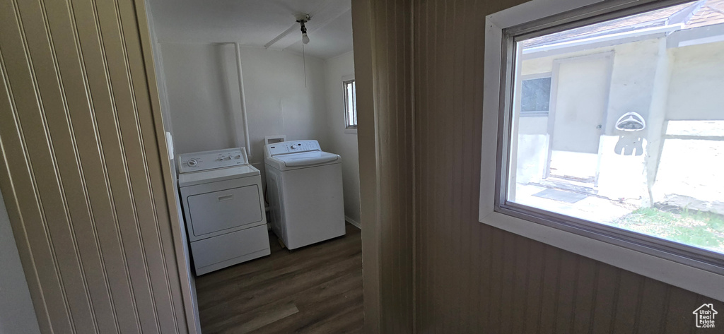 Laundry area featuring washer and clothes dryer and dark wood finished floors