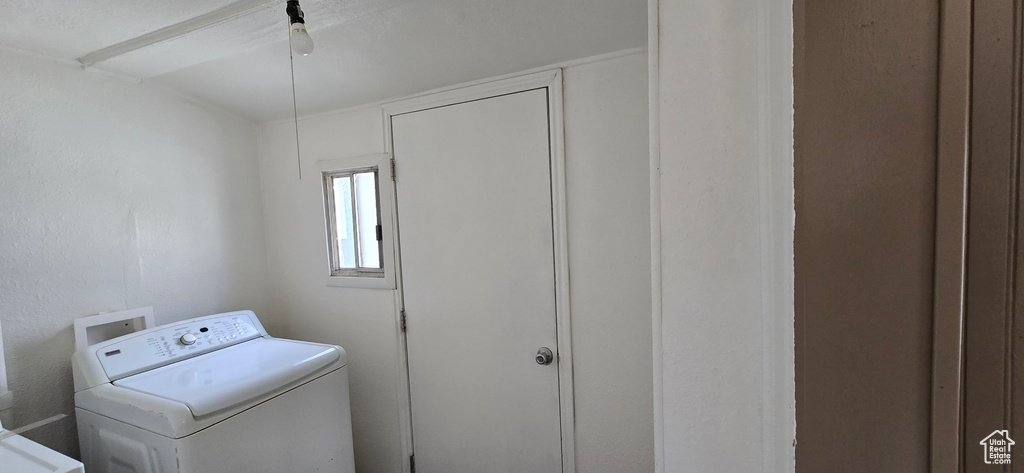 Clothes washing area featuring washer / dryer