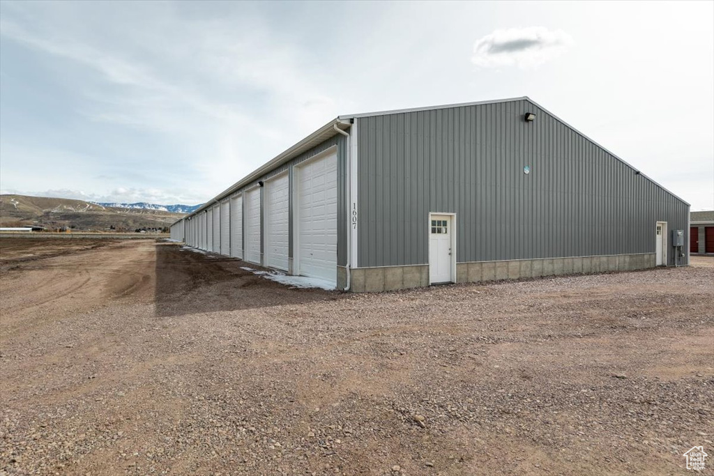 View of outbuilding featuring a mountain view and an outdoor structure
