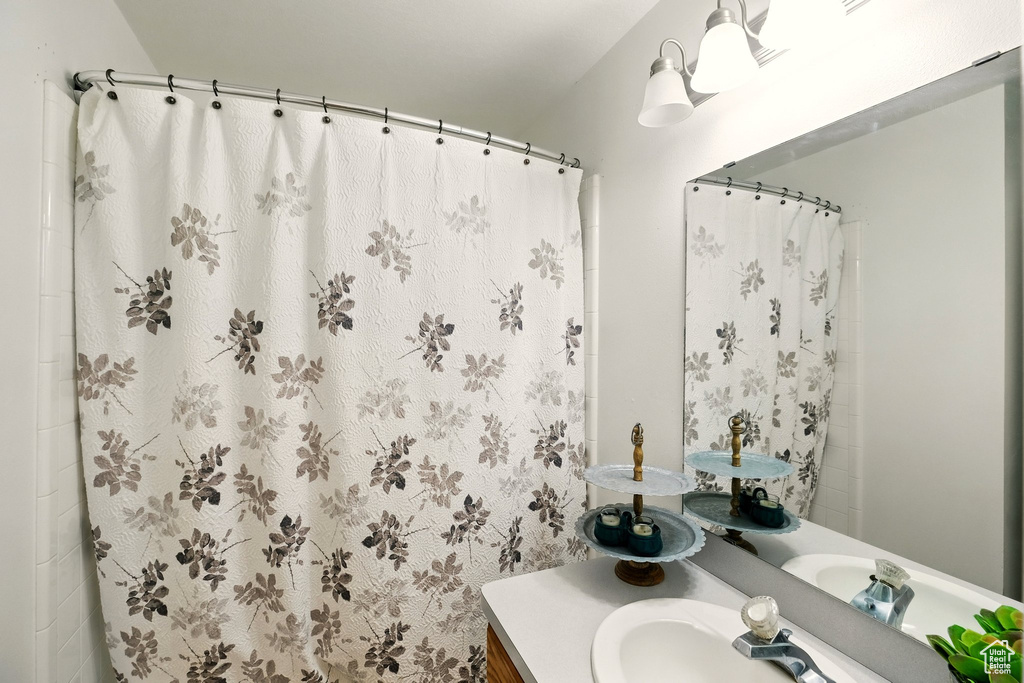 Bathroom with vanity and a shower with curtain