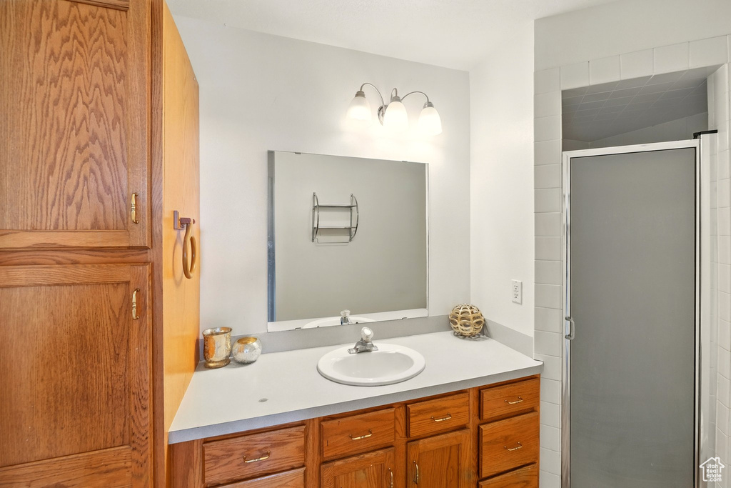 Bathroom with vanity and a shower stall