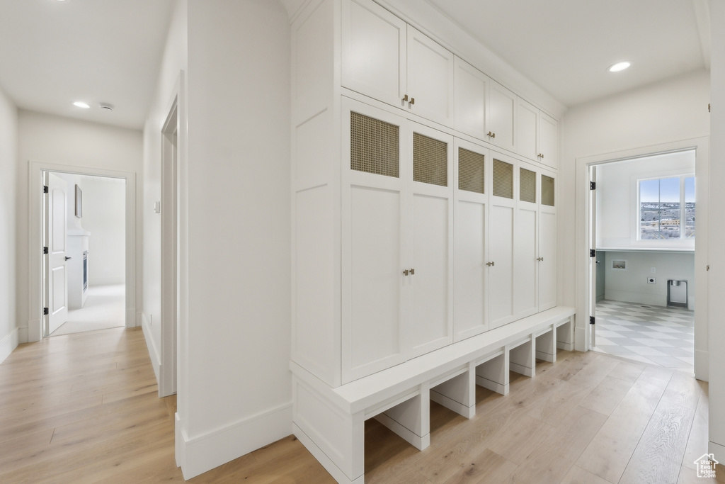 Mudroom with baseboards, recessed lighting, and light wood finished floors