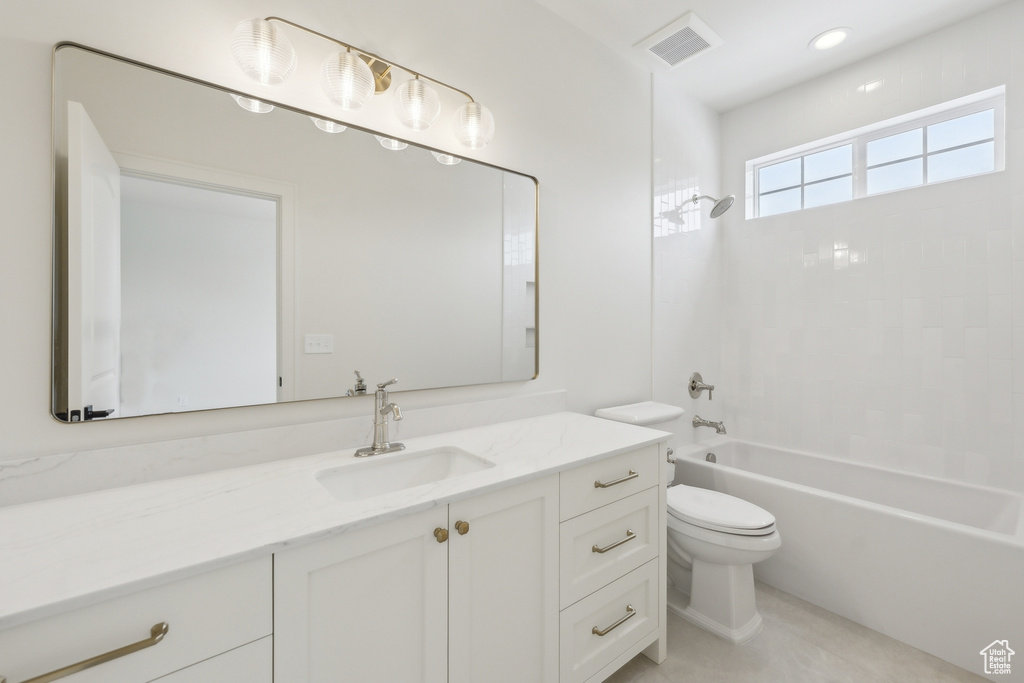 Bathroom featuring vanity, recessed lighting, toilet, bathtub / shower combination, and visible vents