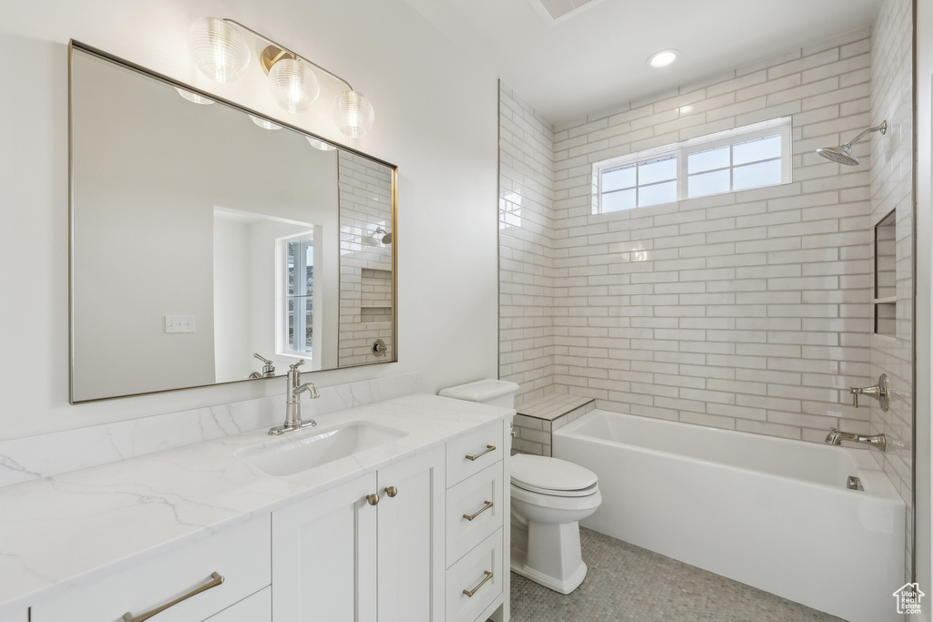 Full bath featuring toilet, shower / tub combination, and vanity