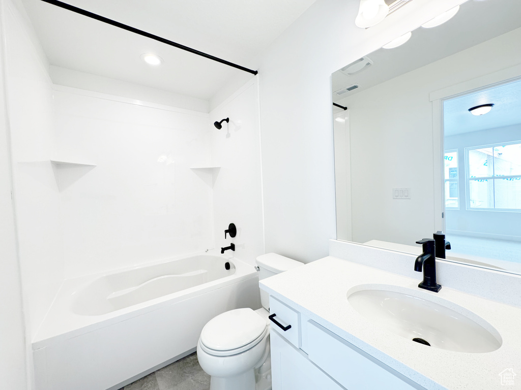Bathroom with toilet, vanity, shower / bath combination, and visible vents