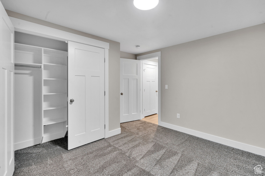 Unfurnished bedroom with carpet floors