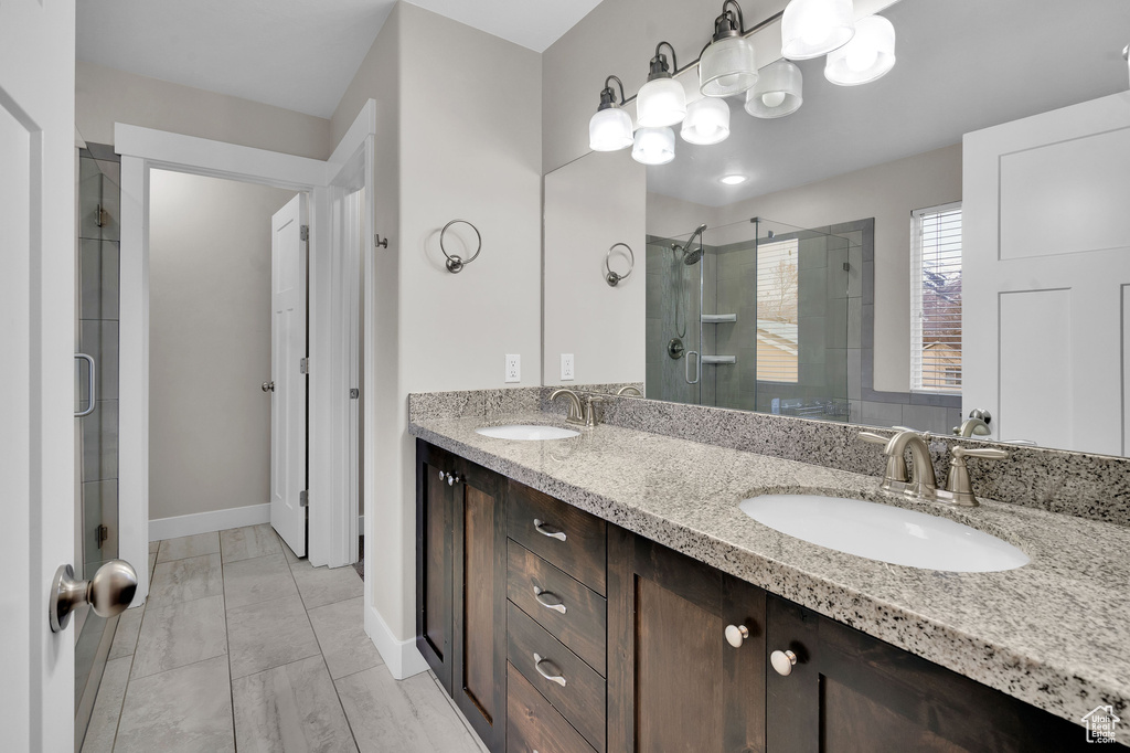 Bathroom featuring vanity and walk in shower