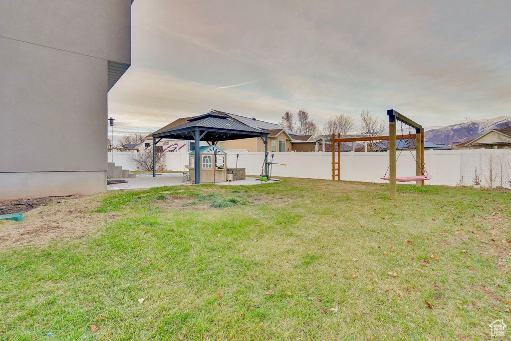 View of yard featuring a gazebo and a patio
