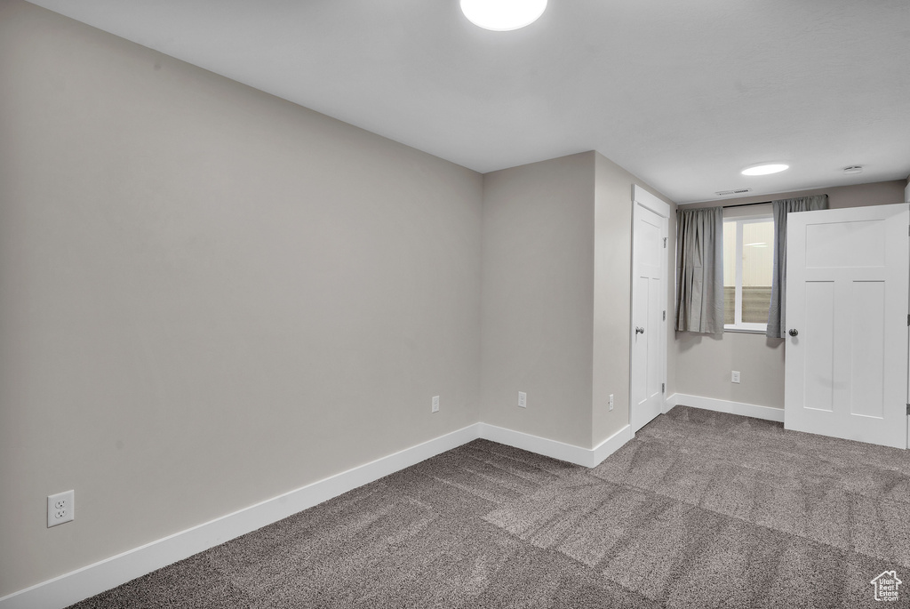 Empty room featuring carpet floors