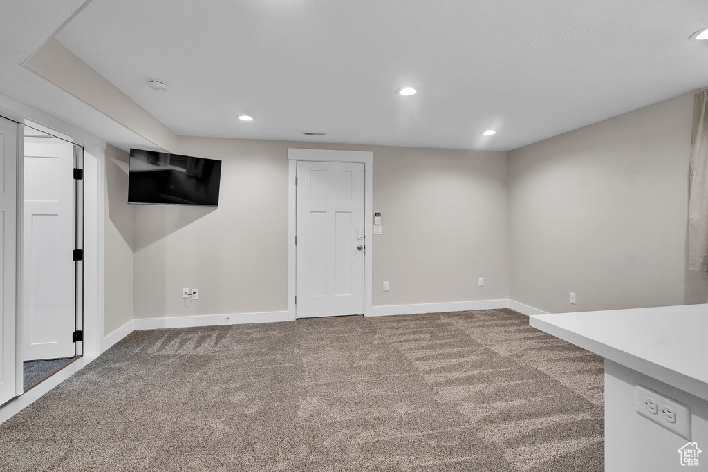 Basement featuring carpet flooring