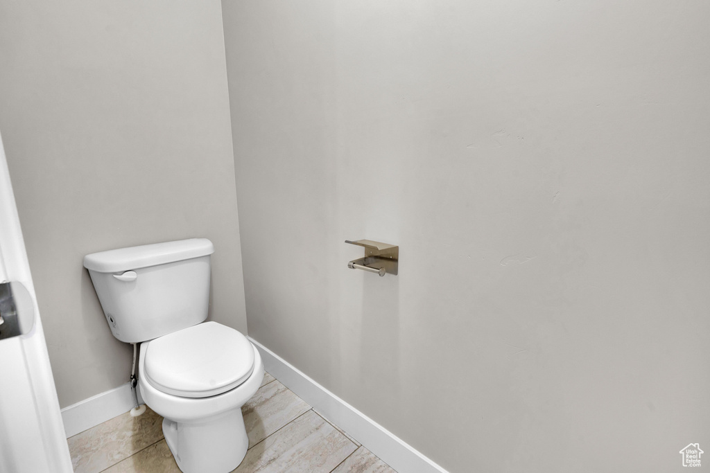 Bathroom with tile patterned floors and toilet