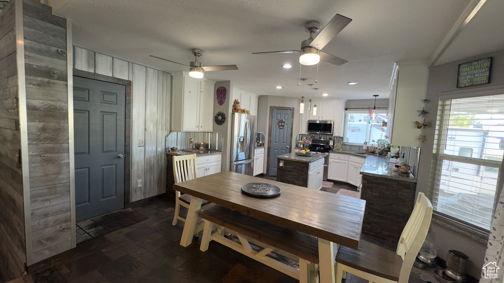 Dining space featuring ceiling fan