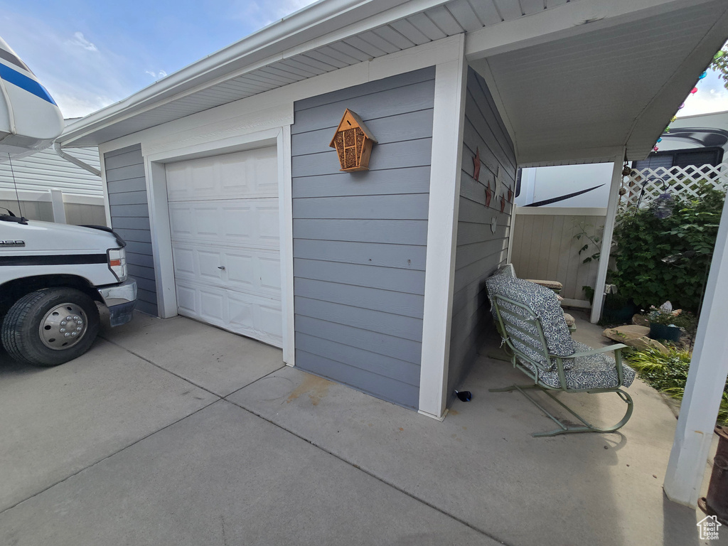 Garage with concrete driveway