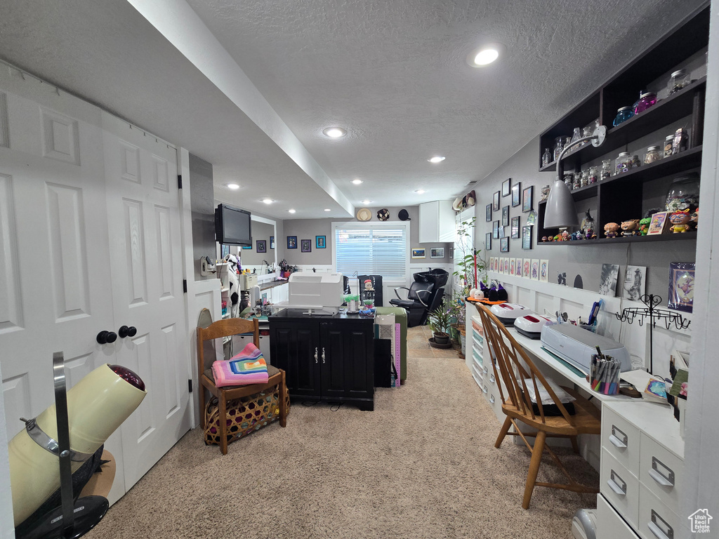 Home office featuring recessed lighting and a textured ceiling
