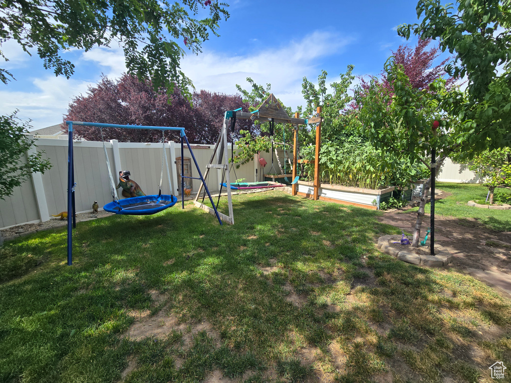 Fenced backyard with a garden