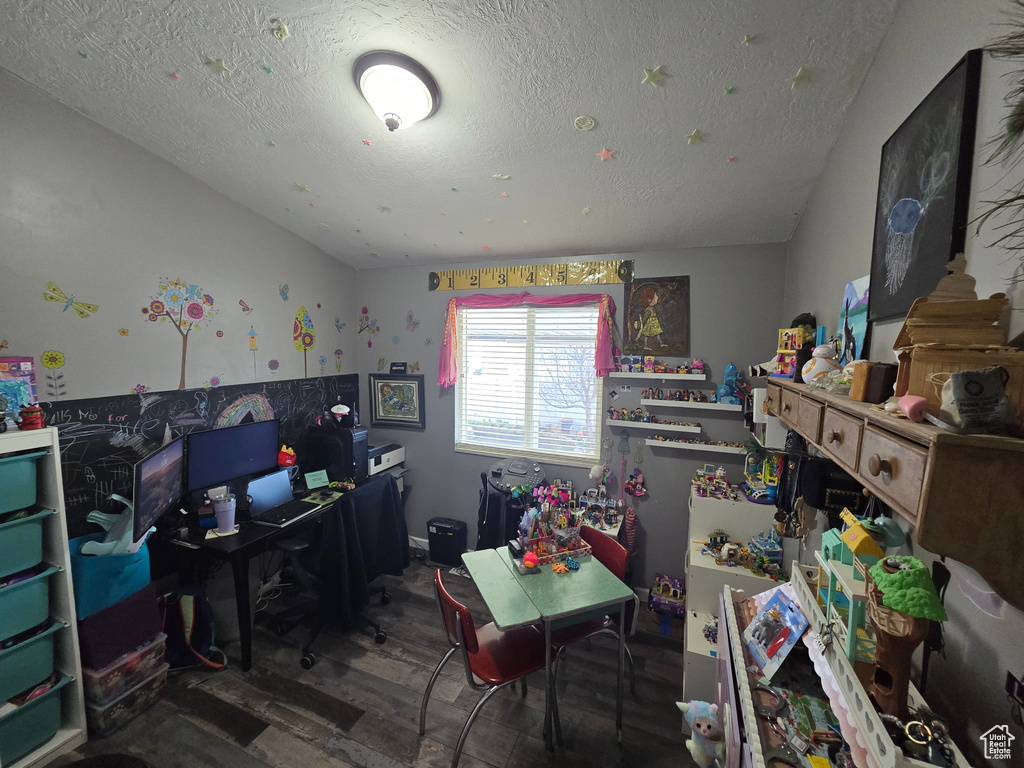 Office featuring a textured ceiling and wood finished floors