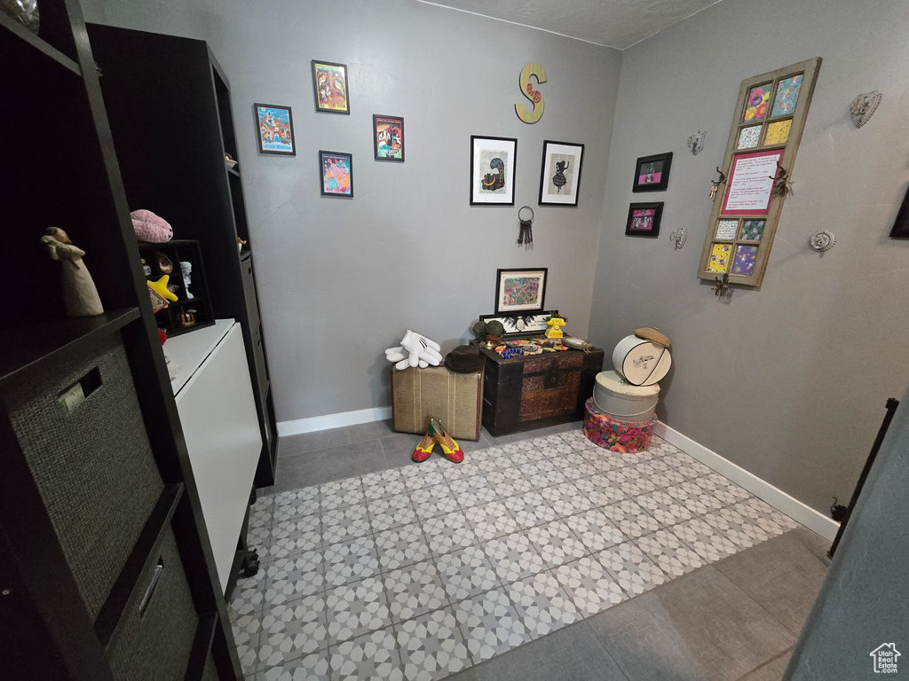 Interior space with tile patterned floors and baseboards