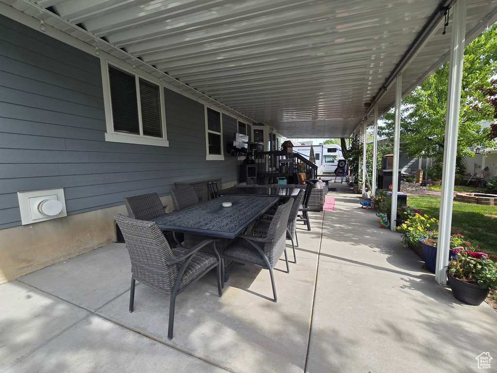 View of patio featuring outdoor dining area