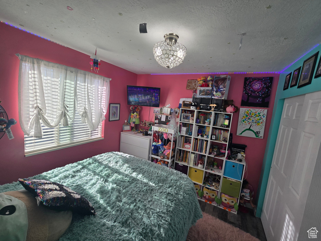 Bedroom featuring a textured ceiling