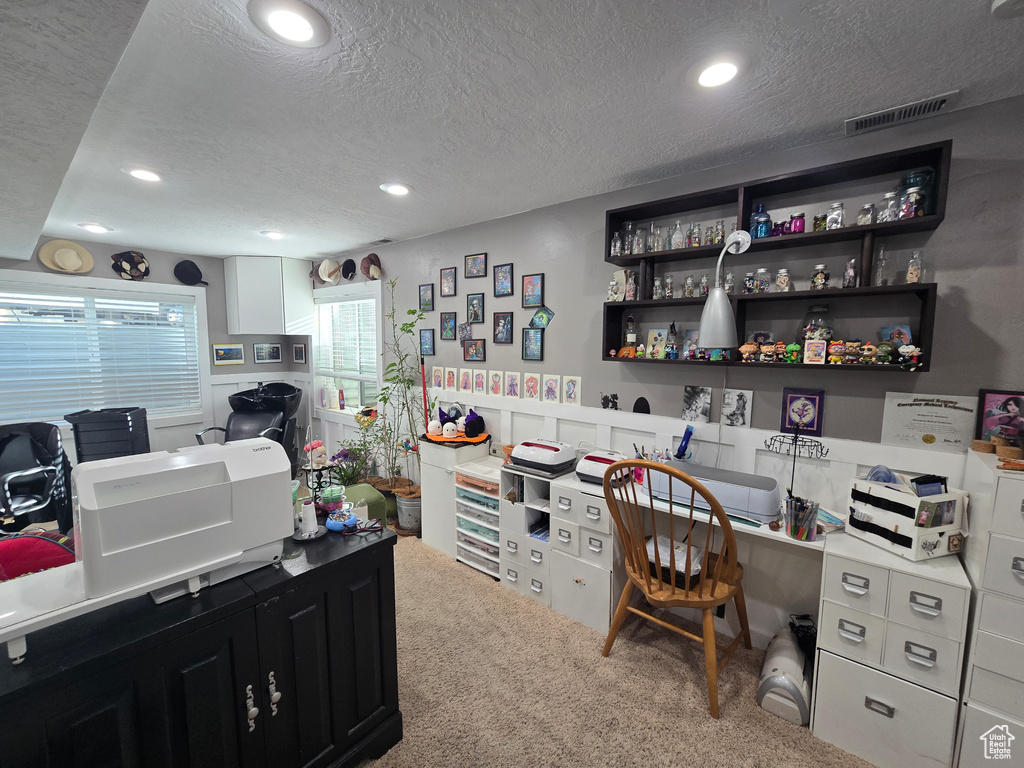 Carpeted office with a wainscoted wall, recessed lighting, a textured ceiling, and visible vents
