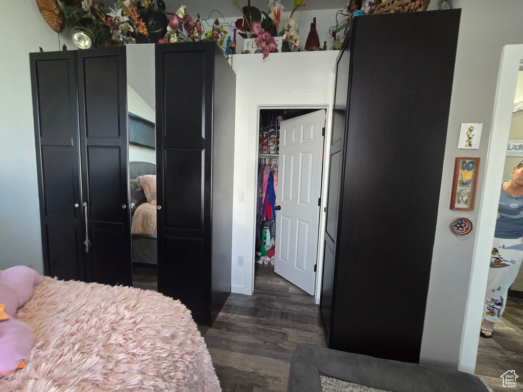 Bedroom featuring dark wood-style flooring