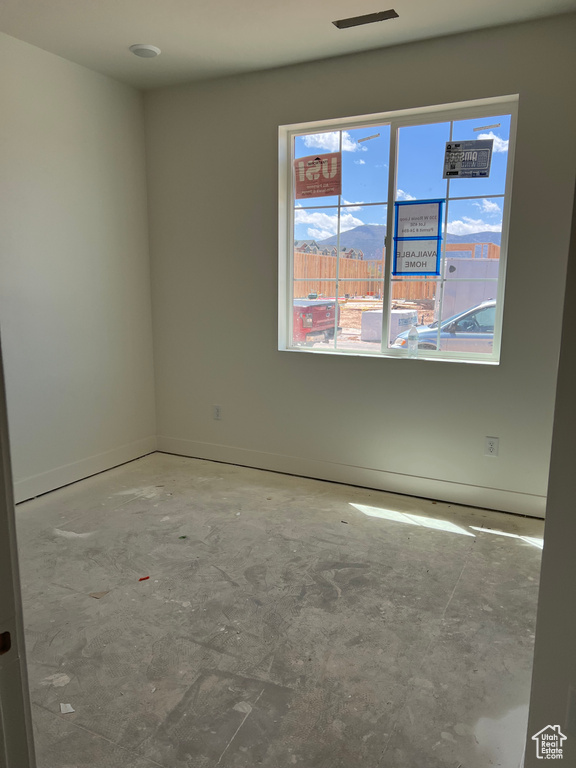Unfurnished room with baseboards