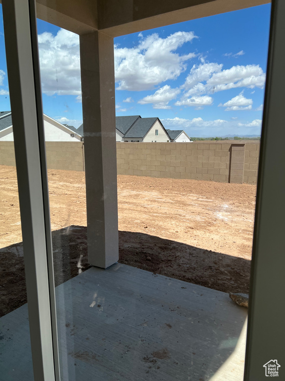 Fenced backyard with a patio