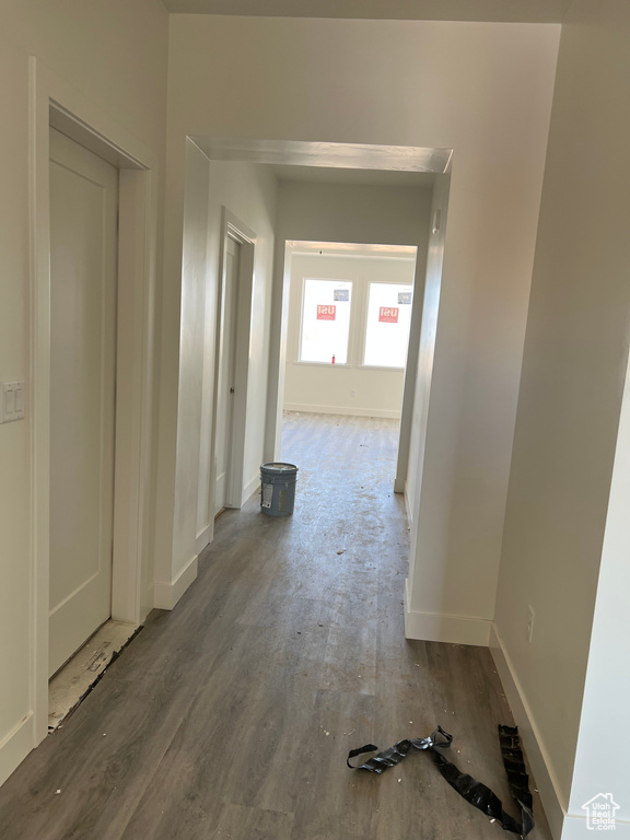 Corridor featuring wood finished floors and baseboards