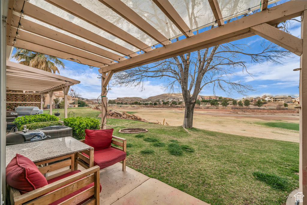 View of patio / terrace with a pergola and a mountain view