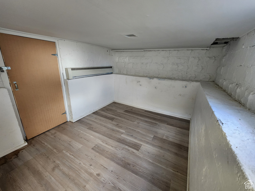 Finished below grade area with light wood-style floors