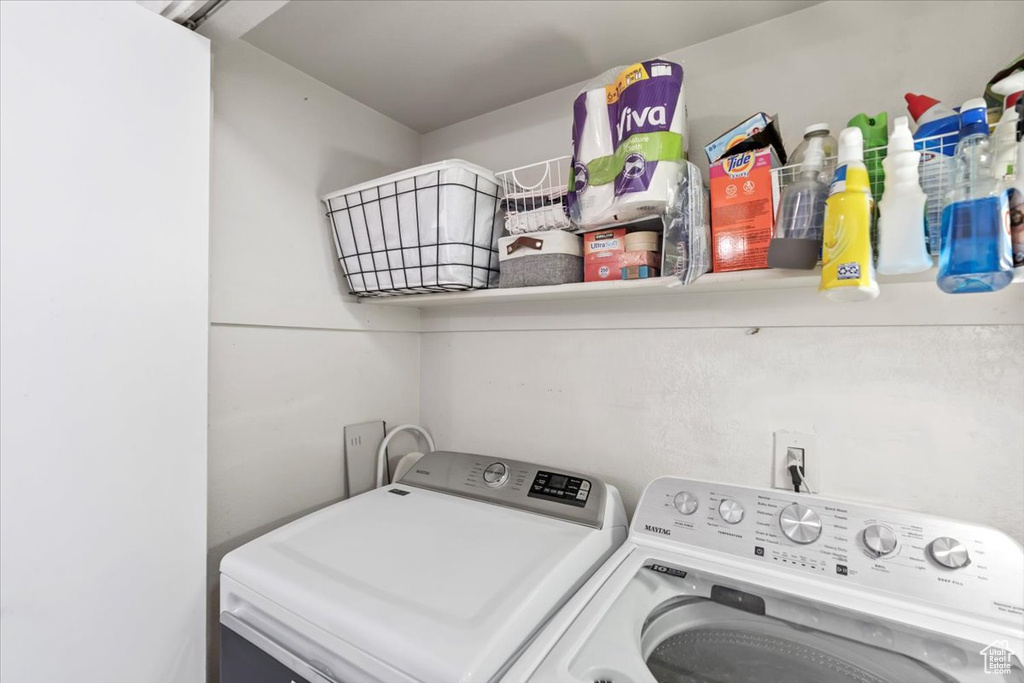 Laundry room with independent washer and dryer and laundry area