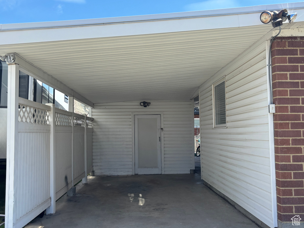 View of patio featuring an attached carport