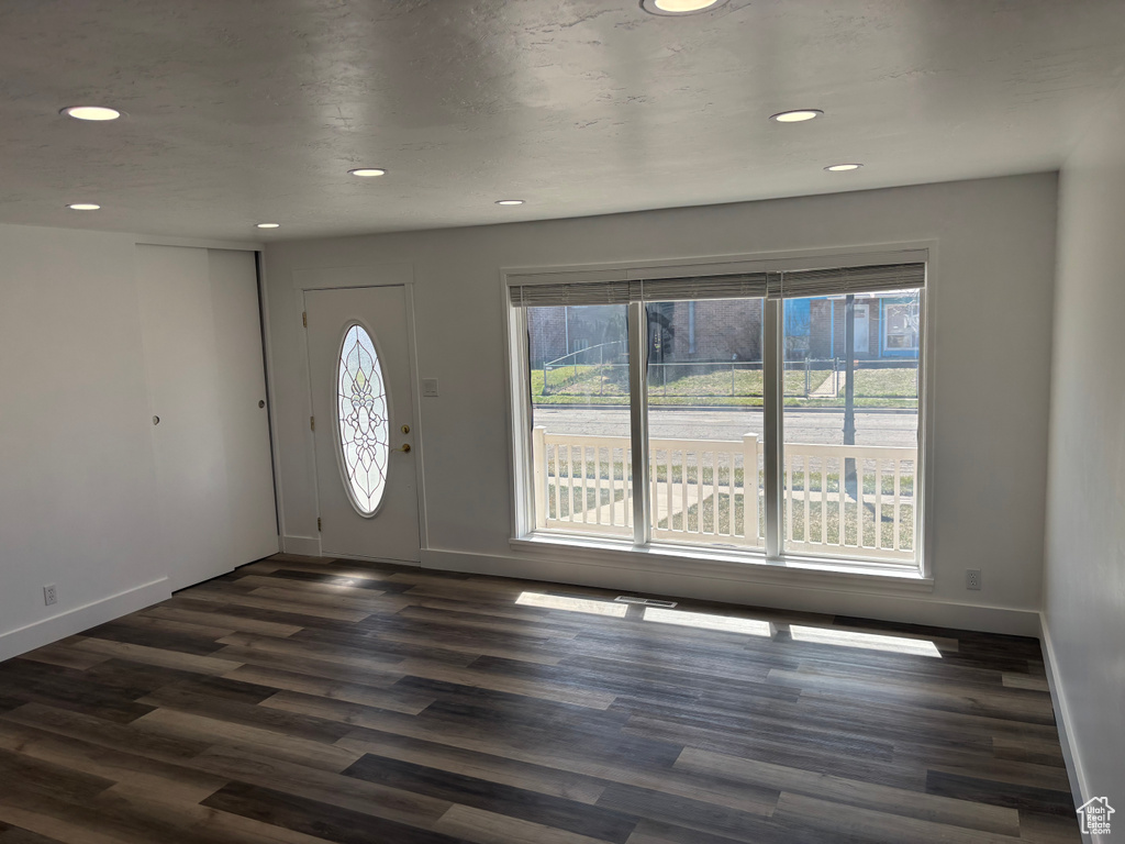 Entryway featuring baseboards, recessed lighting, and dark wood finished floors
