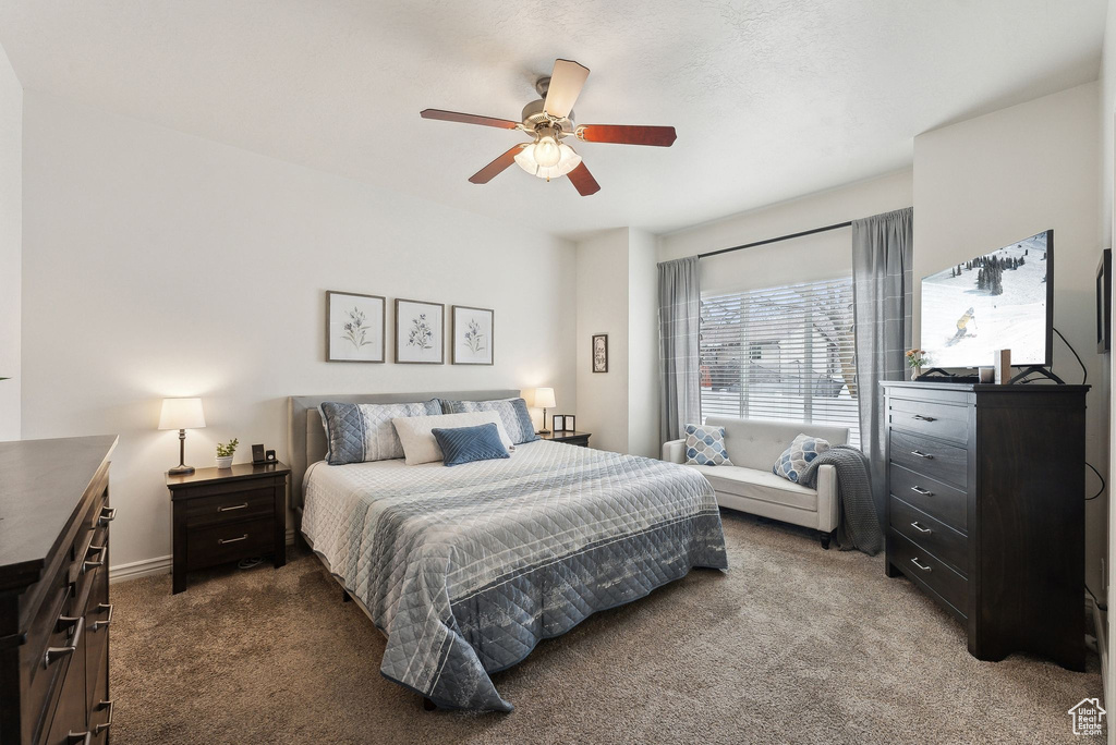 Bedroom with carpet flooring and a ceiling fan