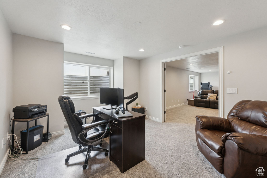 Carpeted home office with baseboards and recessed lighting